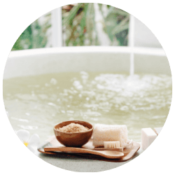 Oatmeal bath in a tub to calm eczema flare-up naturally.