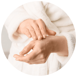 Applying natural shea butter to dry skin for natural eczema relief.